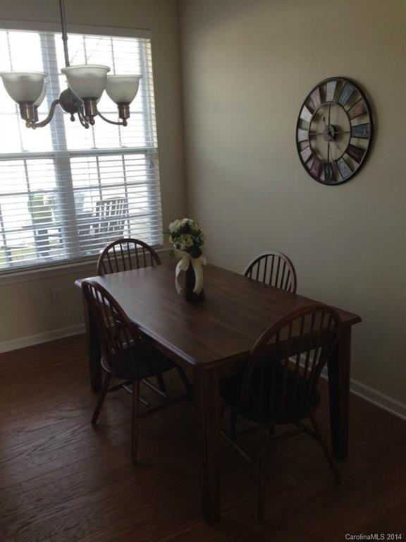 204 Falling Ridge, Unit 145 Belmont, NC 28012 - Photo 5 of 18 a view of a dining room with furniture window and outside view