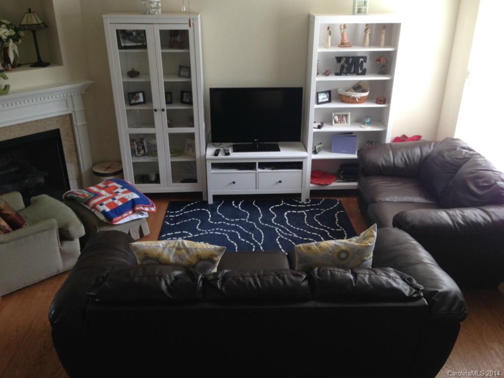 204 Falling Ridge, Unit 145 Belmont, NC 28012 - Photo 6 of 18 a living room with furniture and a flat screen tv