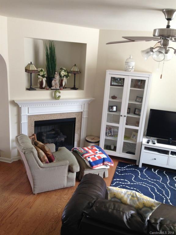 204 Falling Ridge, Unit 145 Belmont, NC 28012 - Photo 7 of 18 a living room with furniture and a fireplace
