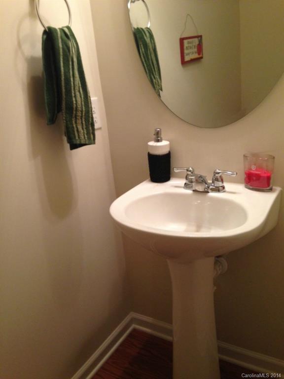 204 Falling Ridge, Unit 145 Belmont, NC 28012 - Photo 8 of 18 a bathroom with a sink and a mirror