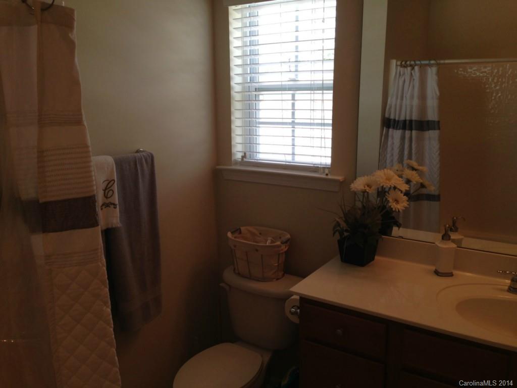 204 Falling Ridge, Unit 145 Belmont, NC 28012 - Photo 9 of 18 a bathroom with a sink toilet and window
