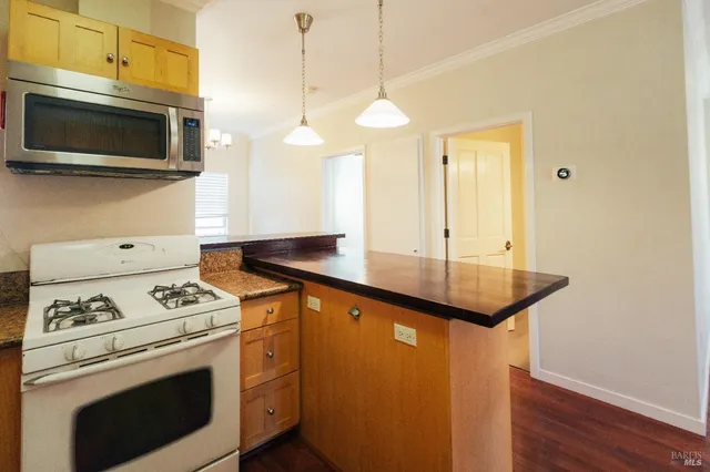 a view of a livingroom with wooden floor