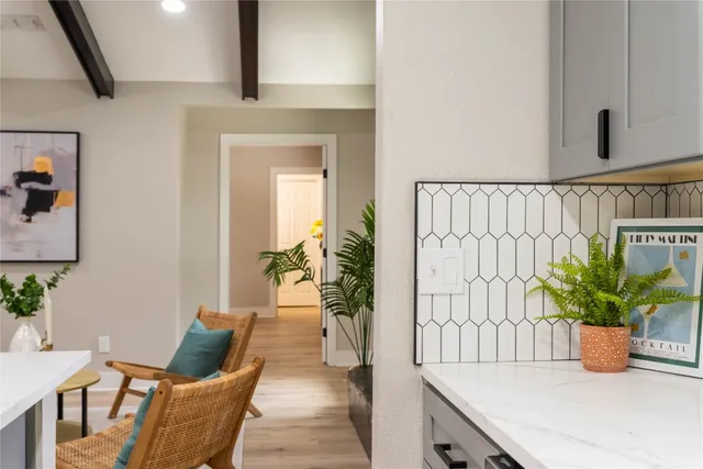 a kitchen with stainless steel appliances kitchen island granite countertop a stove a sink and a microwave