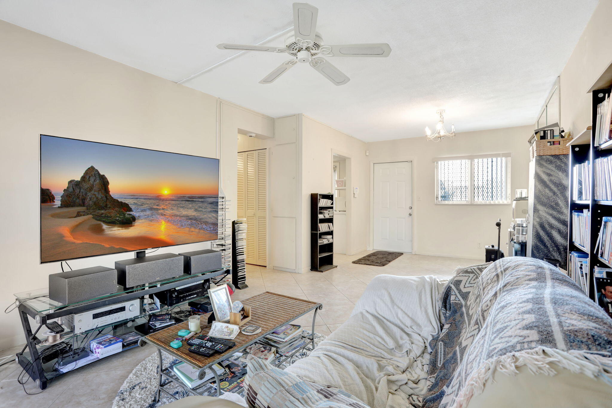 1021 Crystal Lake Drive, Unit 109 Deerfield Beach, FL 33064 - Photo 12 of 21 a bed room with a bed and a television