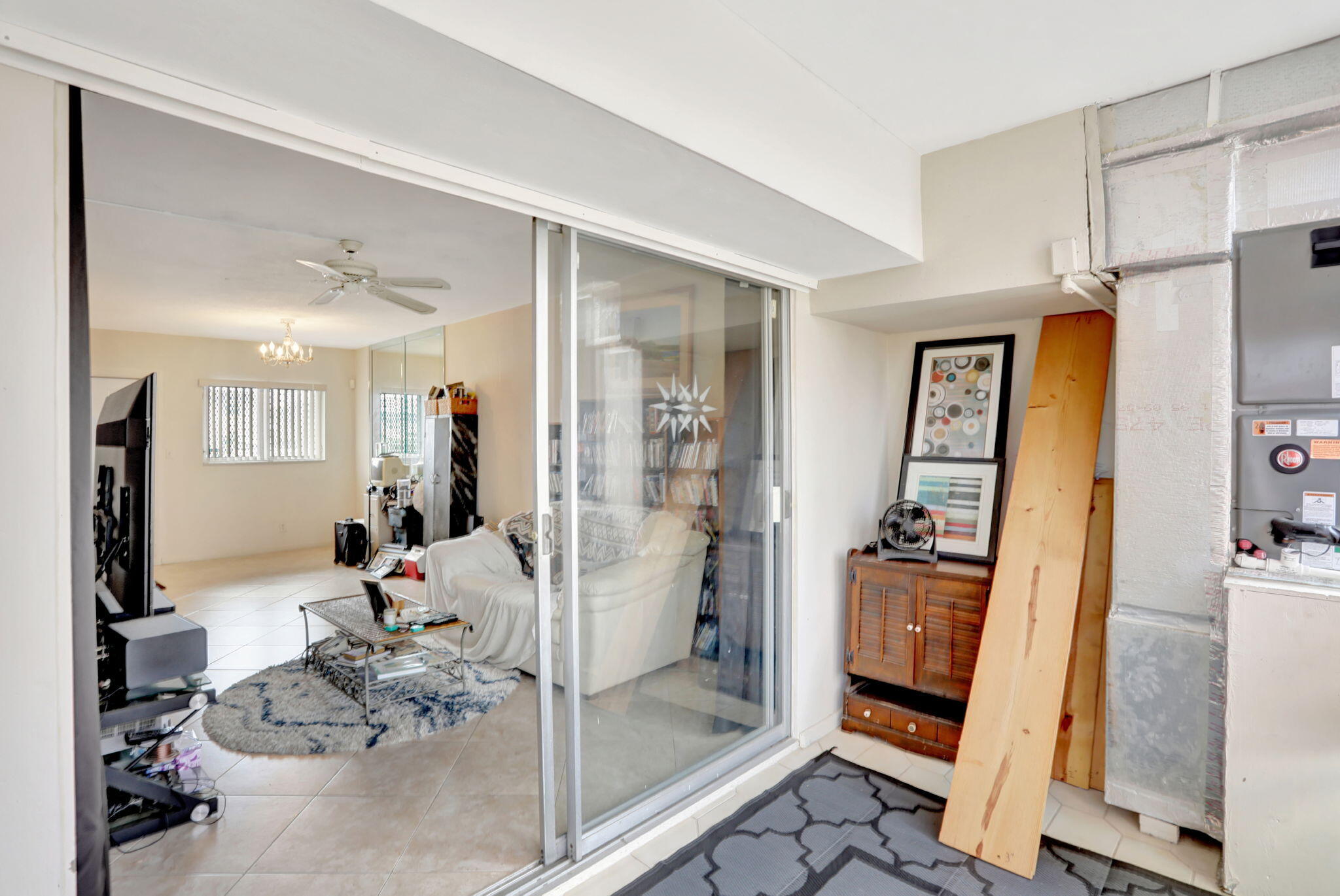 1021 Crystal Lake Drive, Unit 109 Deerfield Beach, FL 33064 - Photo 17 of 21 a view of a entryway with livingroom and furniture