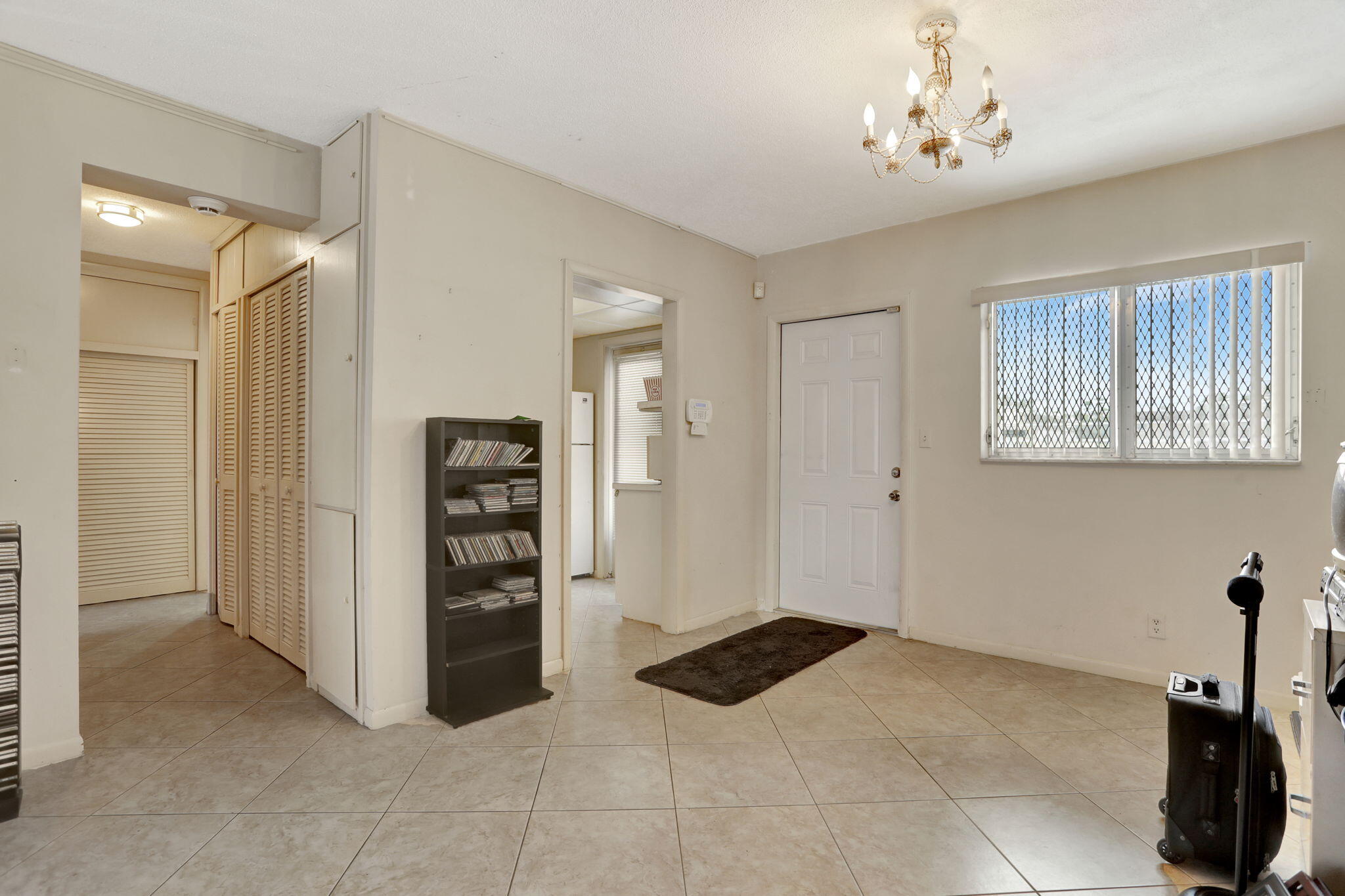 1021 Crystal Lake Drive, Unit 109 Deerfield Beach, FL 33064 - Photo 4 of 21 a view of a bedroom with furniture and closet