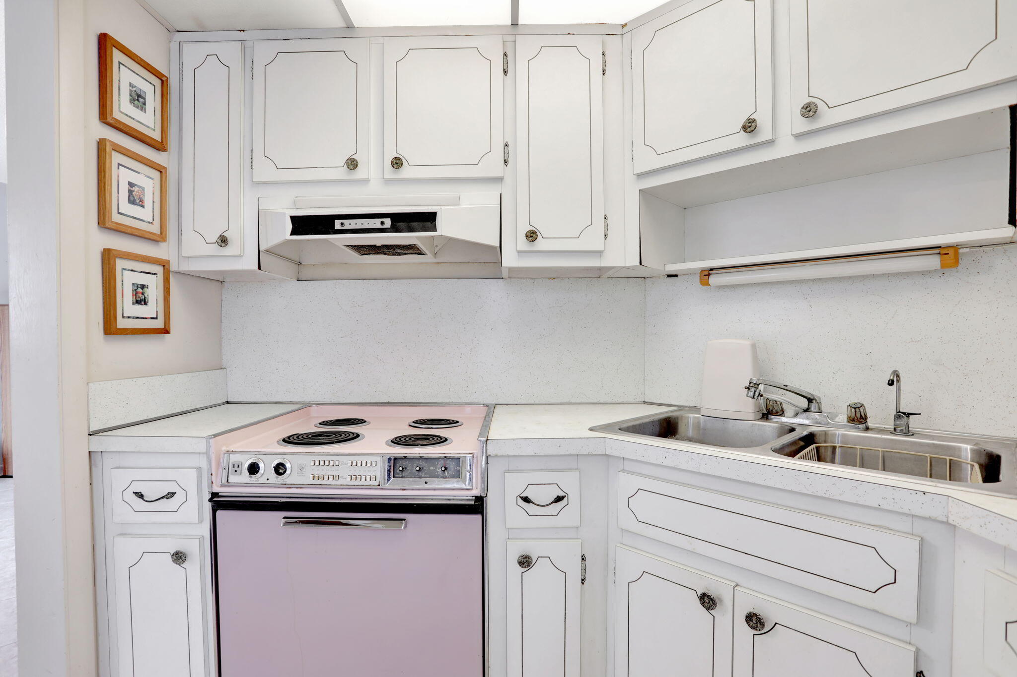 1021 Crystal Lake Drive, Unit 109 Deerfield Beach, FL 33064 - Photo 9 of 21 a kitchen with appliances cabinets and a counter top space
