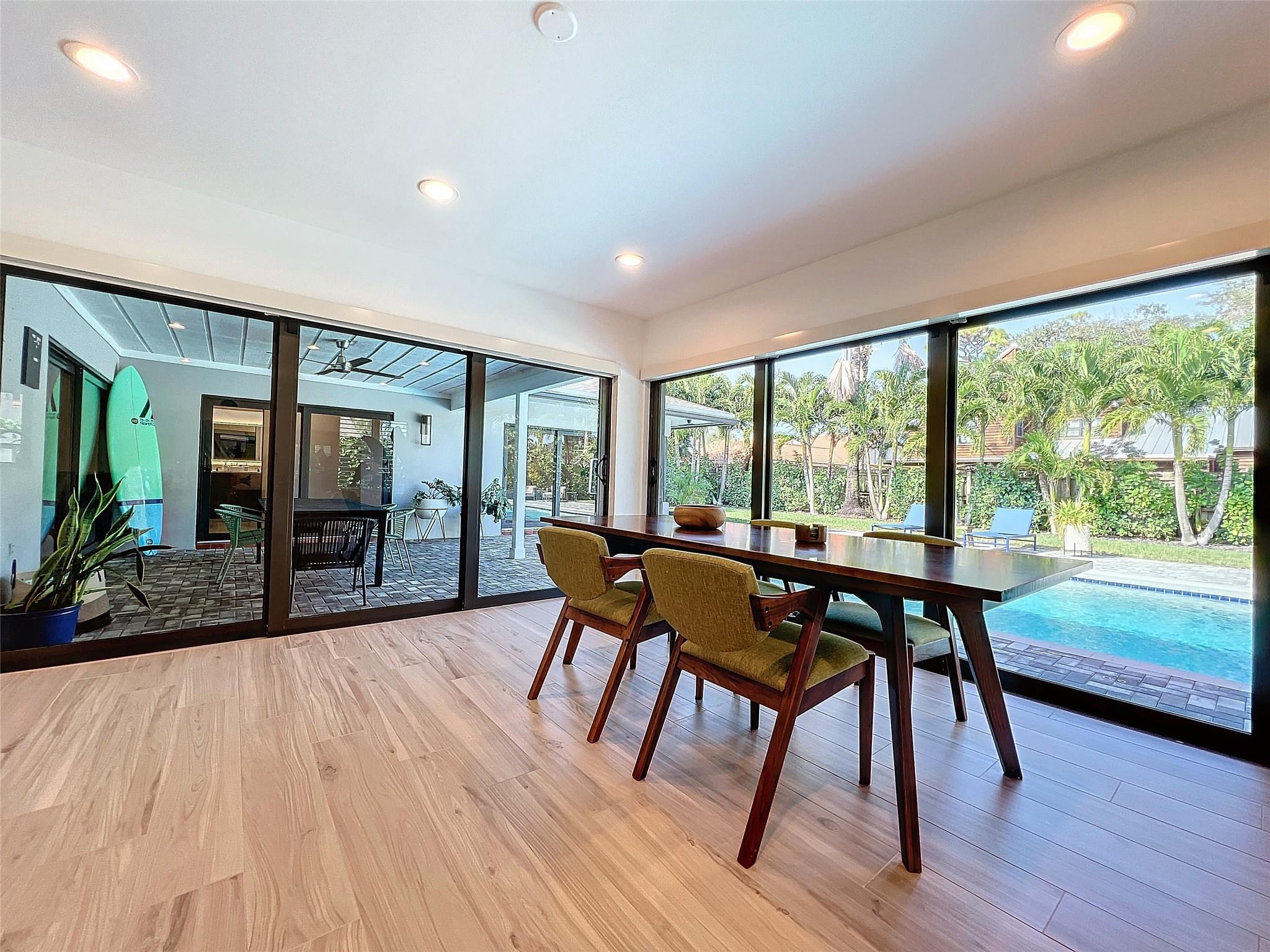 1501 Southwest 17th Street Boca Raton, FL 33486 - Photo 11 of 36 a dining room with furniture and wooden floor