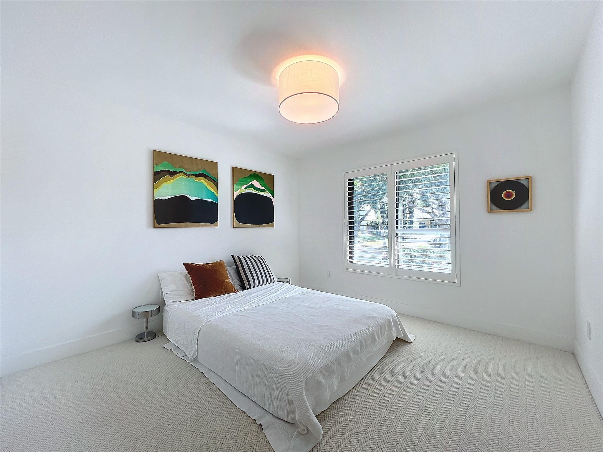1501 Southwest 17th Street Boca Raton, FL 33486 - Photo 18 of 36 a bedroom with a bed and a window