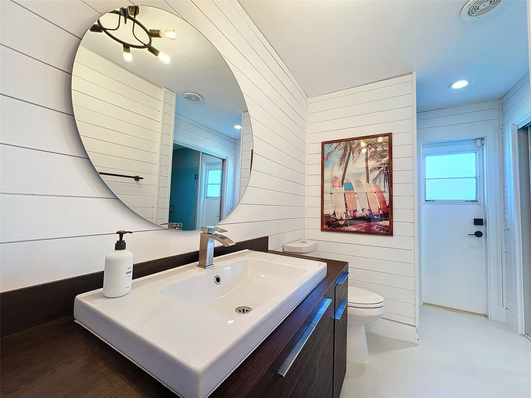 1501 Southwest 17th Street Boca Raton, FL 33486 - Photo 20 of 36 a bathroom with a sink and mirror