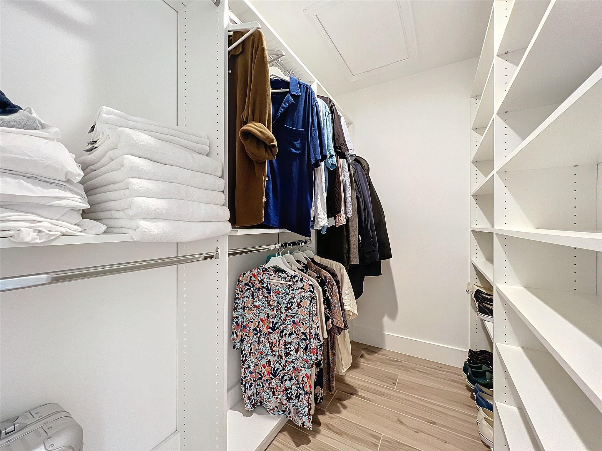 1501 Southwest 17th Street Boca Raton, FL 33486 - Photo 33 of 36 a view of walk in closet with clothes and shoes