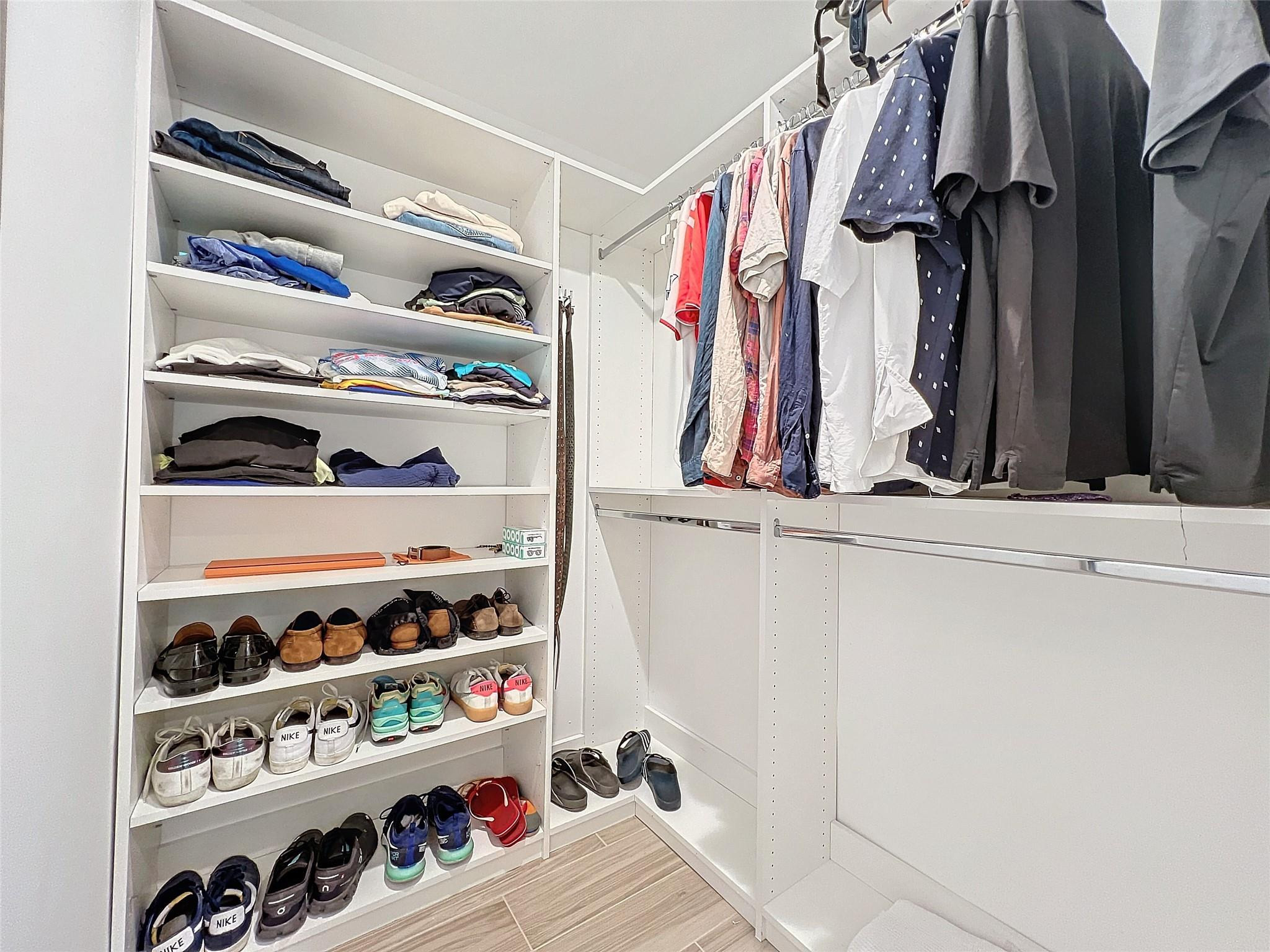 1501 Southwest 17th Street Boca Raton, FL 33486 - Photo 34 of 36 a view of walk in closet with clothes and shoes