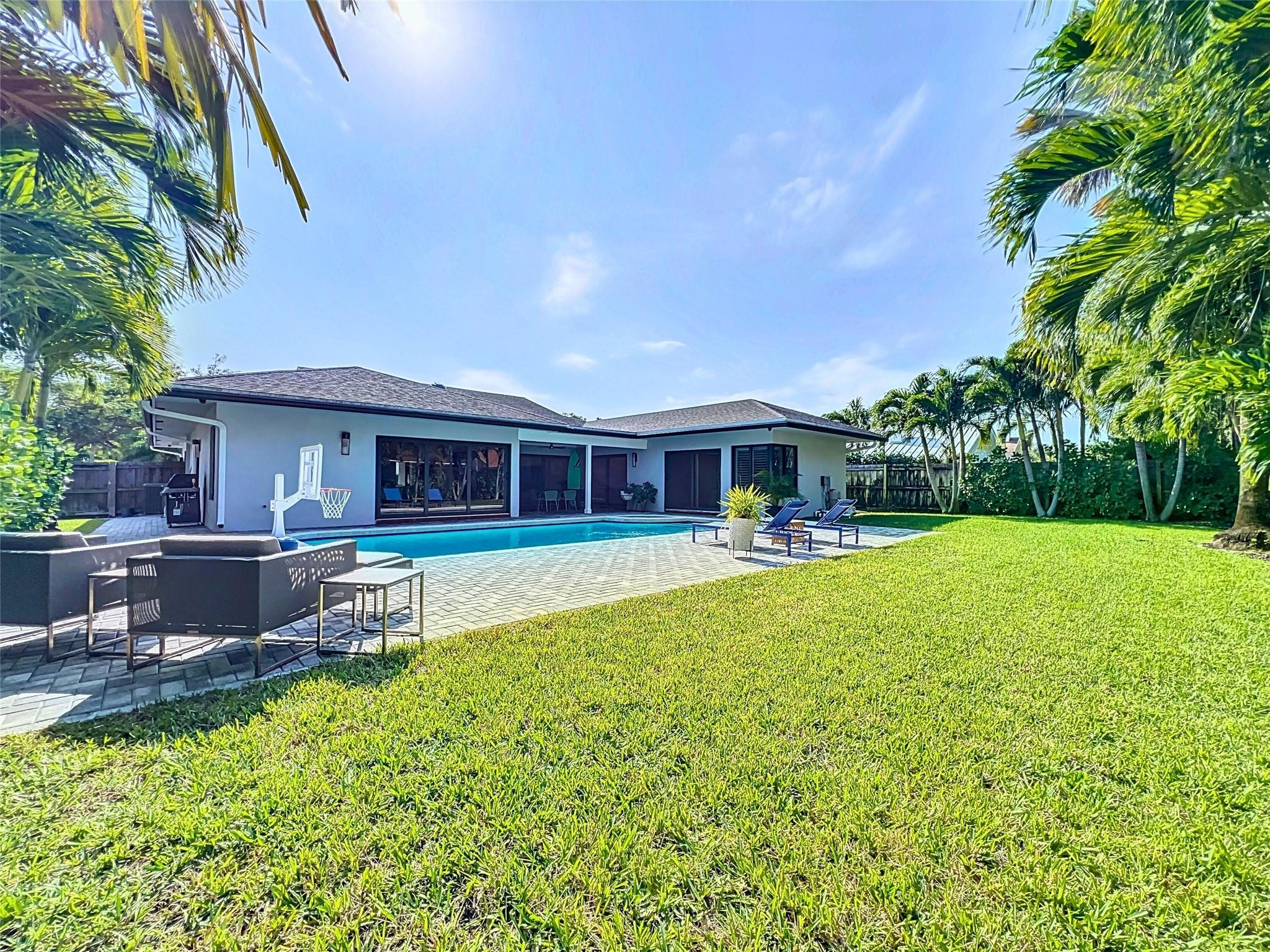 1501 Southwest 17th Street Boca Raton, FL 33486 - Photo 4 of 36 a front view of house with yard and outdoor seating