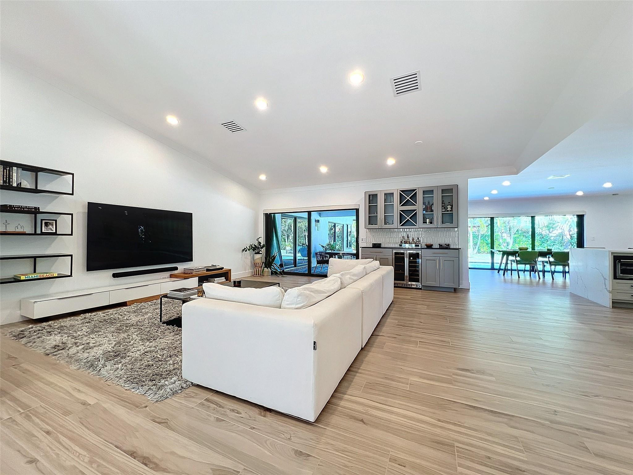 1501 Southwest 17th Street Boca Raton, FL 33486 - Photo 6 of 36 a living room with furniture and a flat screen tv