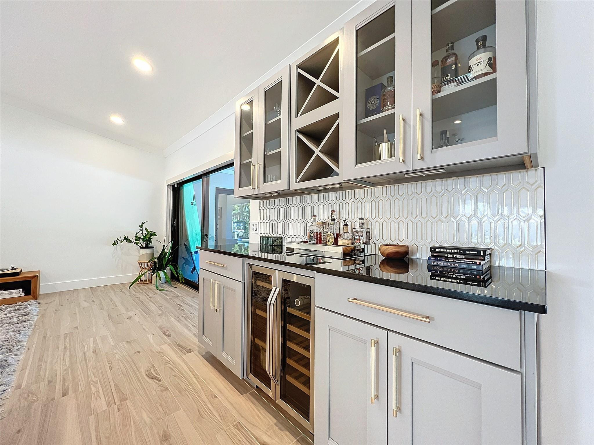 1501 Southwest 17th Street Boca Raton, FL 33486 - Photo 7 of 36 a kitchen with stainless steel appliances granite countertop a sink and cabinets