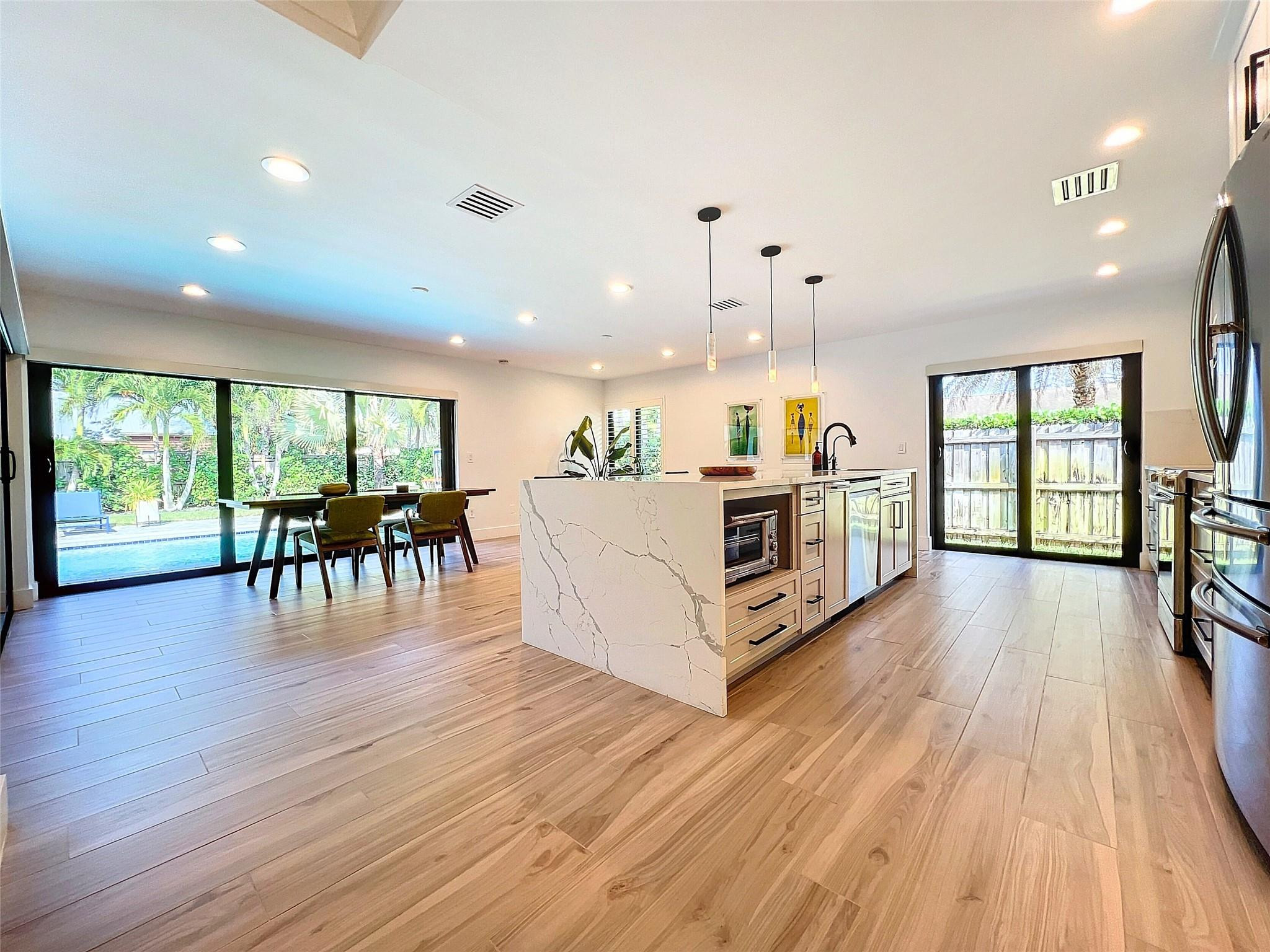 1501 Southwest 17th Street Boca Raton, FL 33486 - Photo 8 of 36 a view of a kitchen with furniture and wooden floor