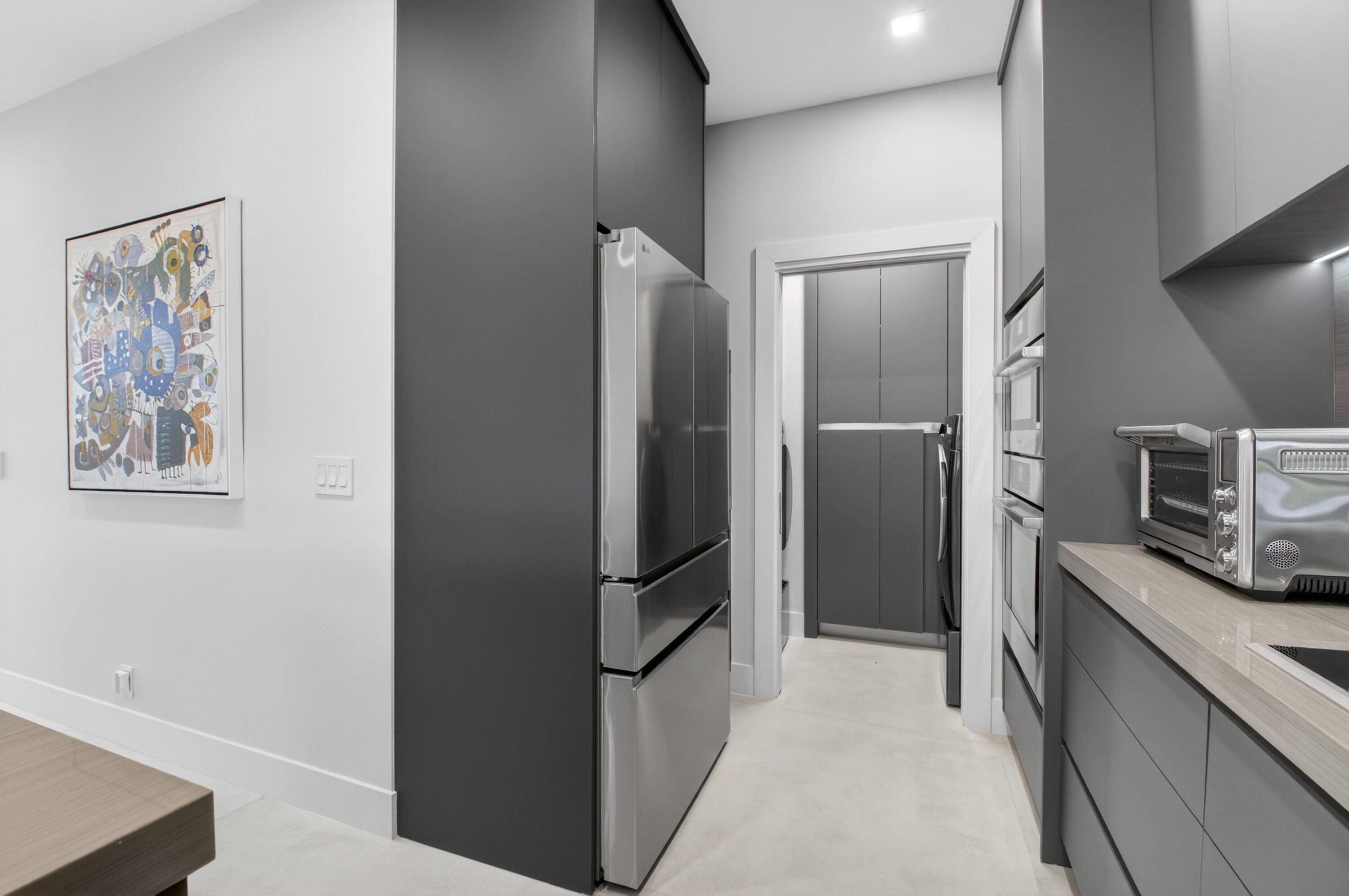 19221 Sabal Lake Drive, Unit 5124 Boca Raton, FL 33434 - Photo 12 of 98 a view of a kitchen with fridge and hallway