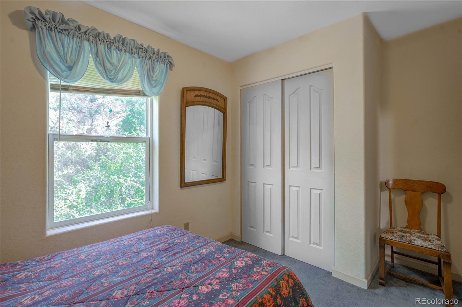 1206 Biddle Street Georgetown, CO 80444 - Photo 15 of 32 a bedroom with a bed and a window