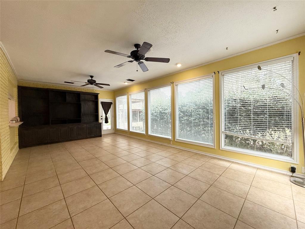 2104 Greenbriar Drive Ruston, LA 71270 - Photo 15 of 35 a view of an empty room with a fireplace and a large window