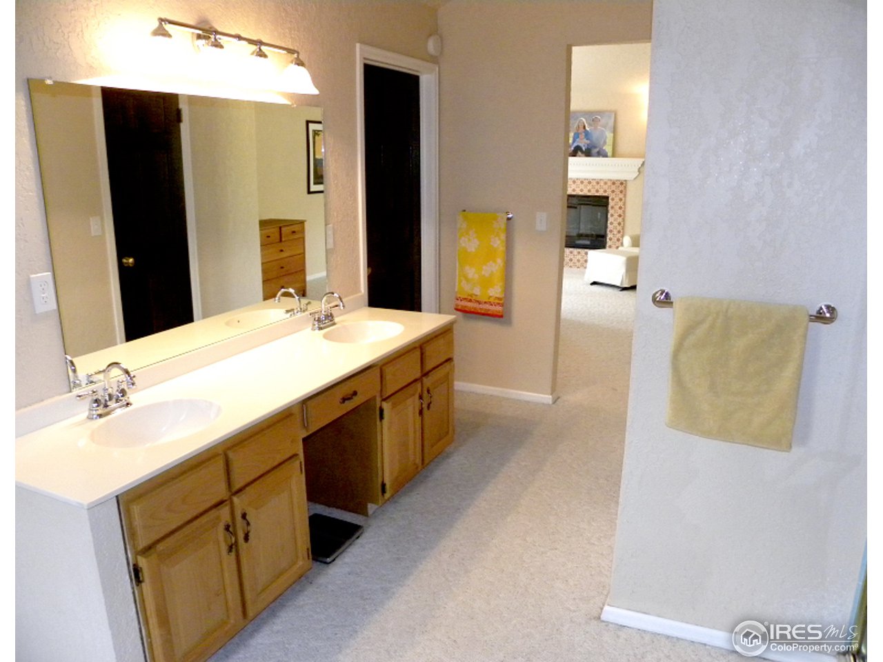 7176 Four Rivers Road Boulder, CO 80301 - Photo 20 of 24 a spacious bathroom with a double vanity sink and a mirror