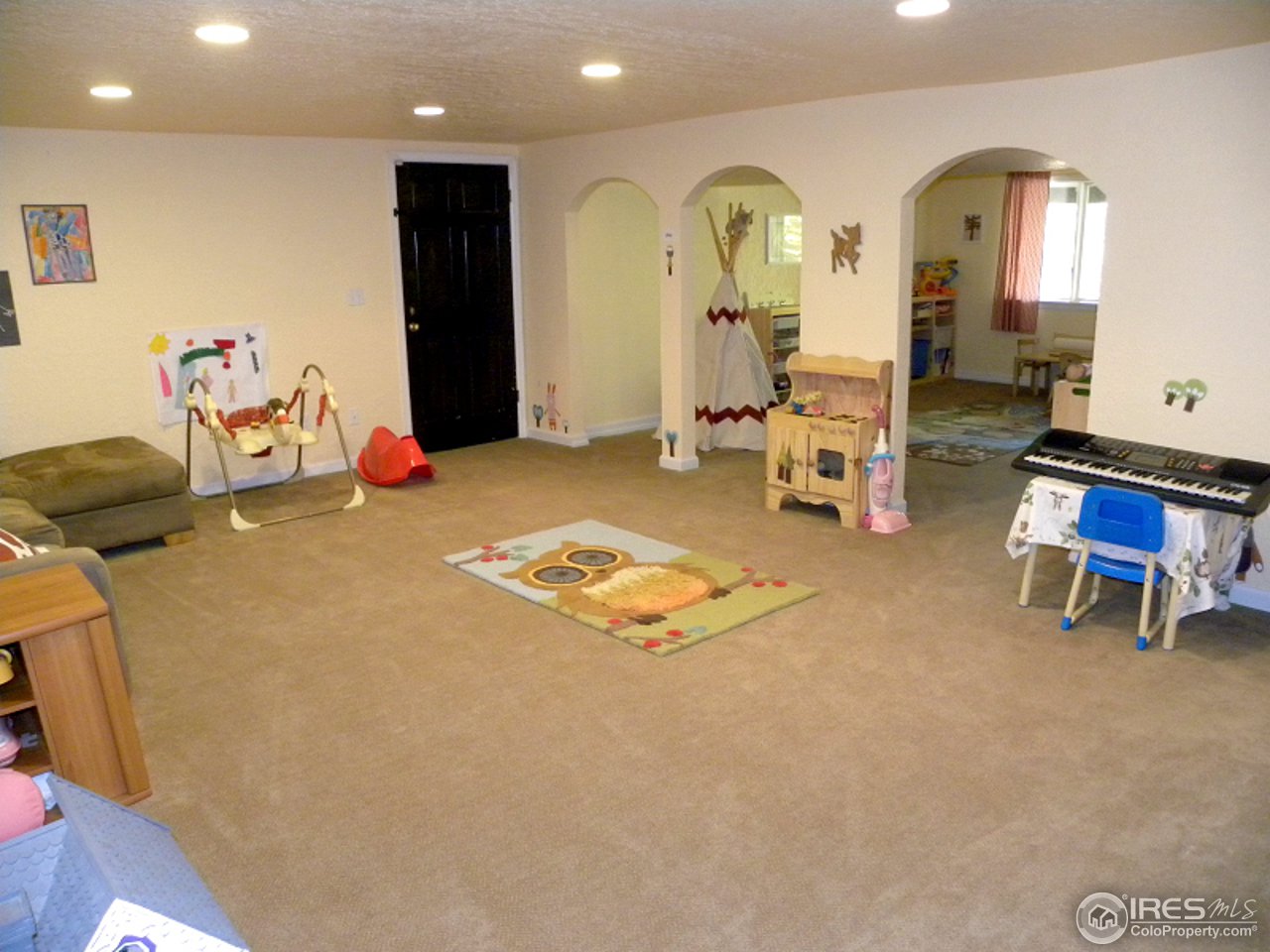 7176 Four Rivers Road Boulder, CO 80301 - Photo 21 of 24 a living room with furniture and a wooden floor