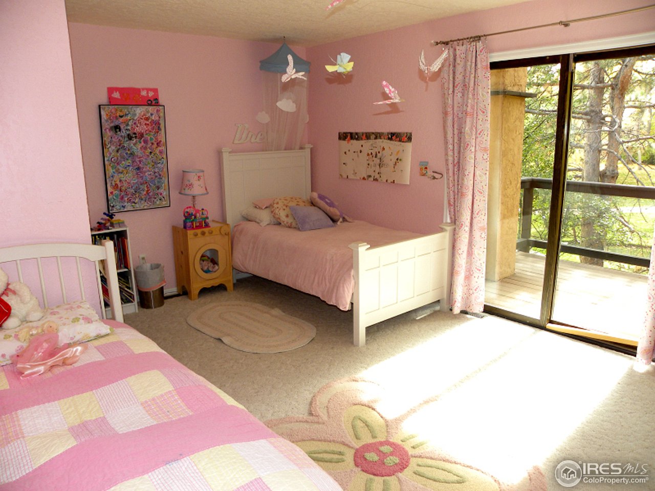 7176 Four Rivers Road Boulder, CO 80301 - Photo 23 of 24 a bedroom with a bed and a large window