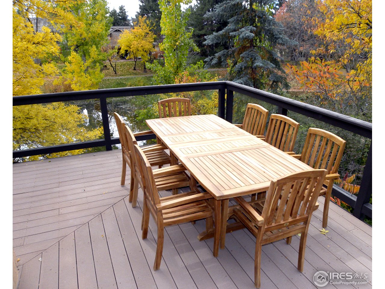 7176 Four Rivers Road Boulder, CO 80301 - Photo 8 of 24 a view of a balcony with wooden floor and outdoor seating