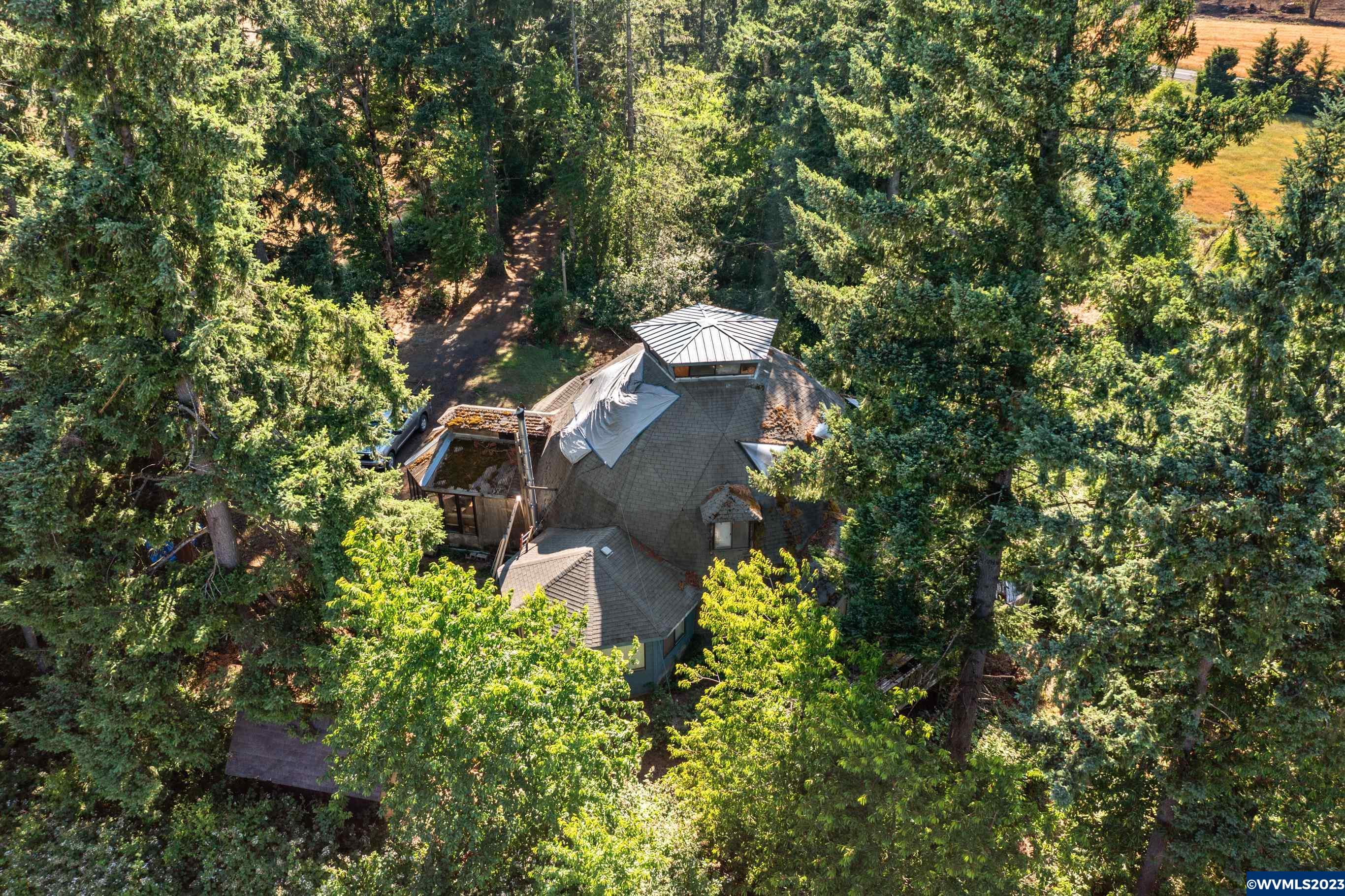 5106 Victor Point Road Southeast Sublimity, OR 97385 - Photo 1 of 10 an aerial view of a house with yard and outdoor seating