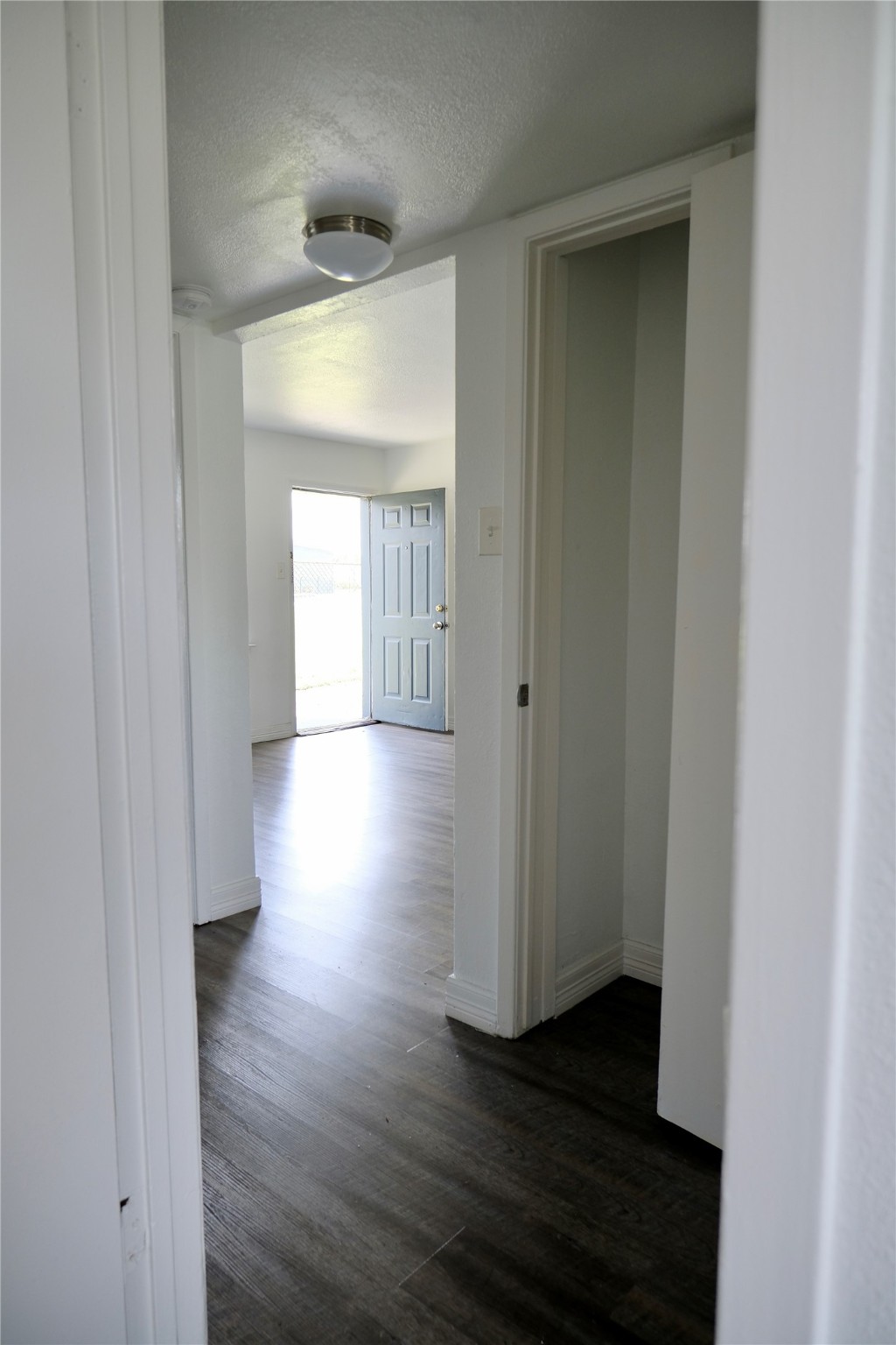 5602 Market Street, Unit 11 Houston, TX 77020 - Photo 13 of 29 View from bedroom 2 to hallway and dining room, Images are for illustrative purposes only and may represent a similar unit. Actual finishes, layout, and features may vary