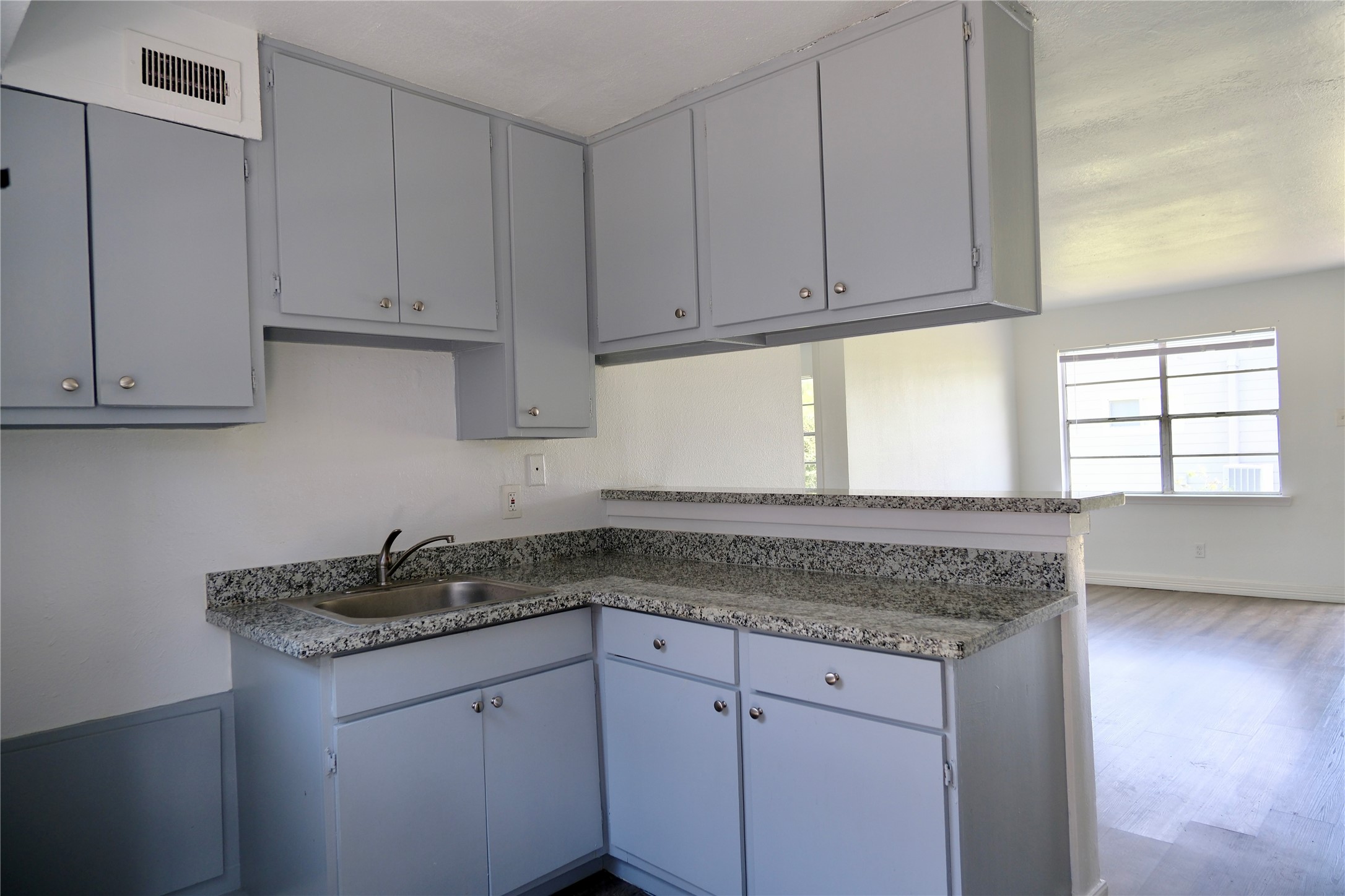 5602 Market Street, Unit 11 Houston, TX 77020 - Photo 25 of 29 Refreshed kitchen cabinetry and countertops, Images are for illustrative purposes only and may represent a similar unit. Actual finishes, layout, and features may vary