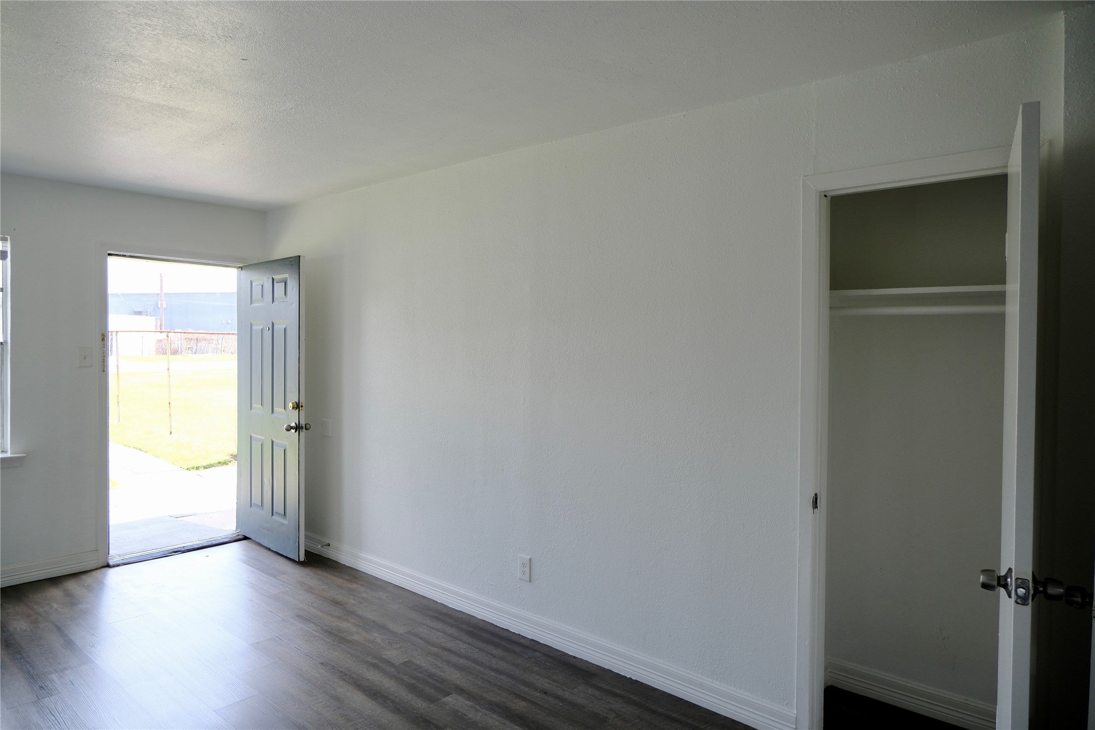 5602 Market Street, Unit 11 Houston, TX 77020 - Photo 6 of 29 Living room with coat closet, Images are for illustrative purposes only and may represent a similar unit. Actual finishes, layout, and features may vary