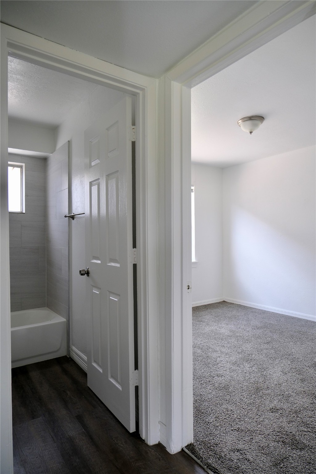 5602 Market Street, Unit 11 Houston, TX 77020 - Photo 9 of 29 Bathroom with bedroom 2 in view, Images are for illustrative purposes only and may represent a similar unit. Actual finishes, layout, and features may vary