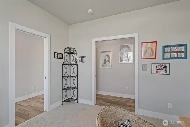 a view of a room with wooden floor and closet