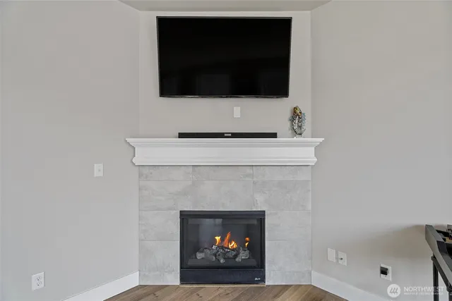 a living room with a fireplace and a fireplace