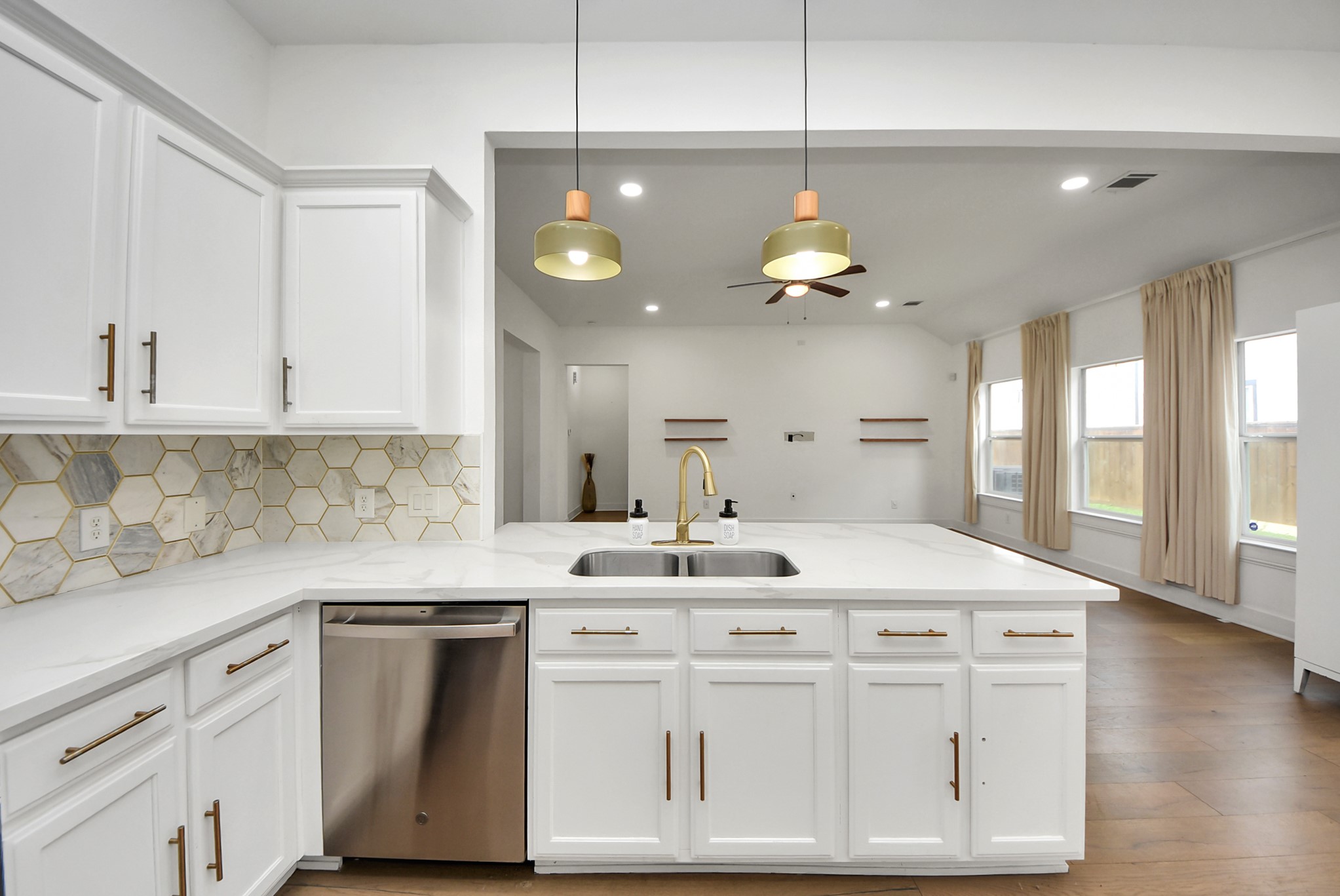 2311 Canfield Street Houston, TX 77004 - Photo 14 of 38 a kitchen with a white cabinets and chandelier
