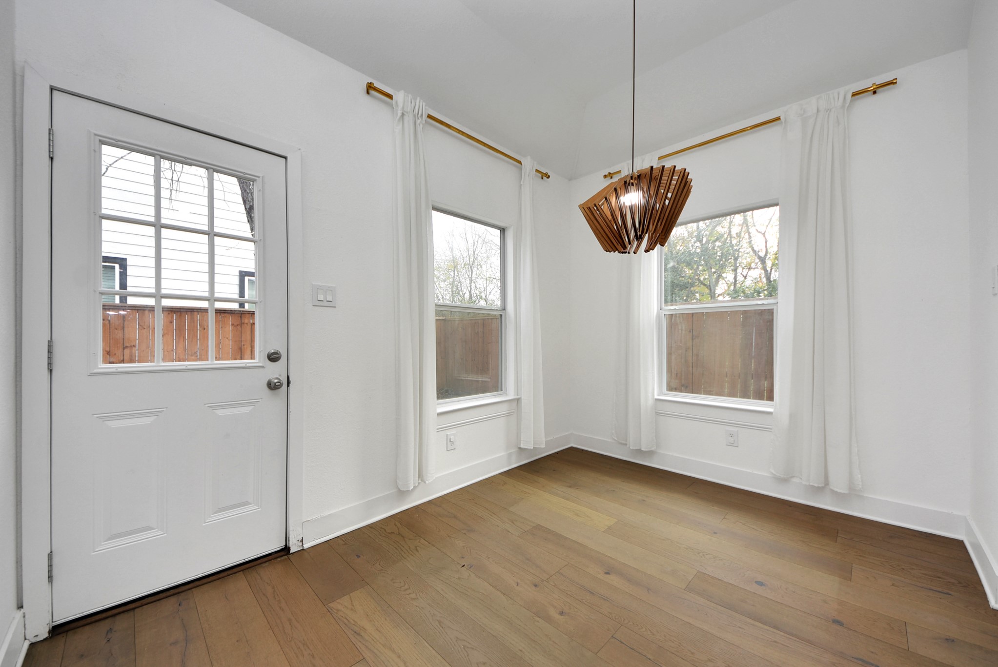 2311 Canfield Street Houston, TX 77004 - Photo 16 of 38 a view of empty room with wooden floor and fan