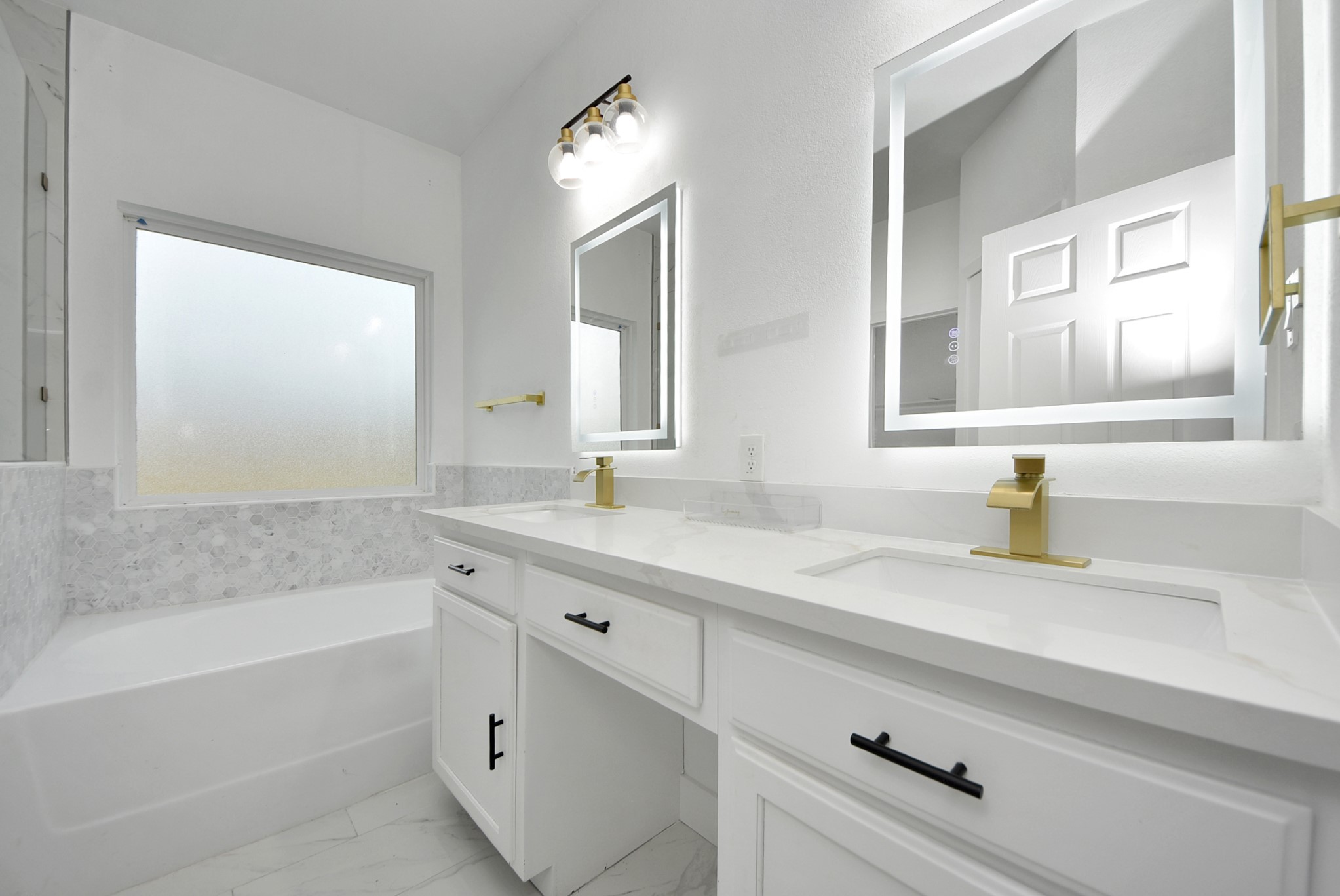 2311 Canfield Street Houston, TX 77004 - Photo 24 of 38 a bathroom with a tub sink and mirror