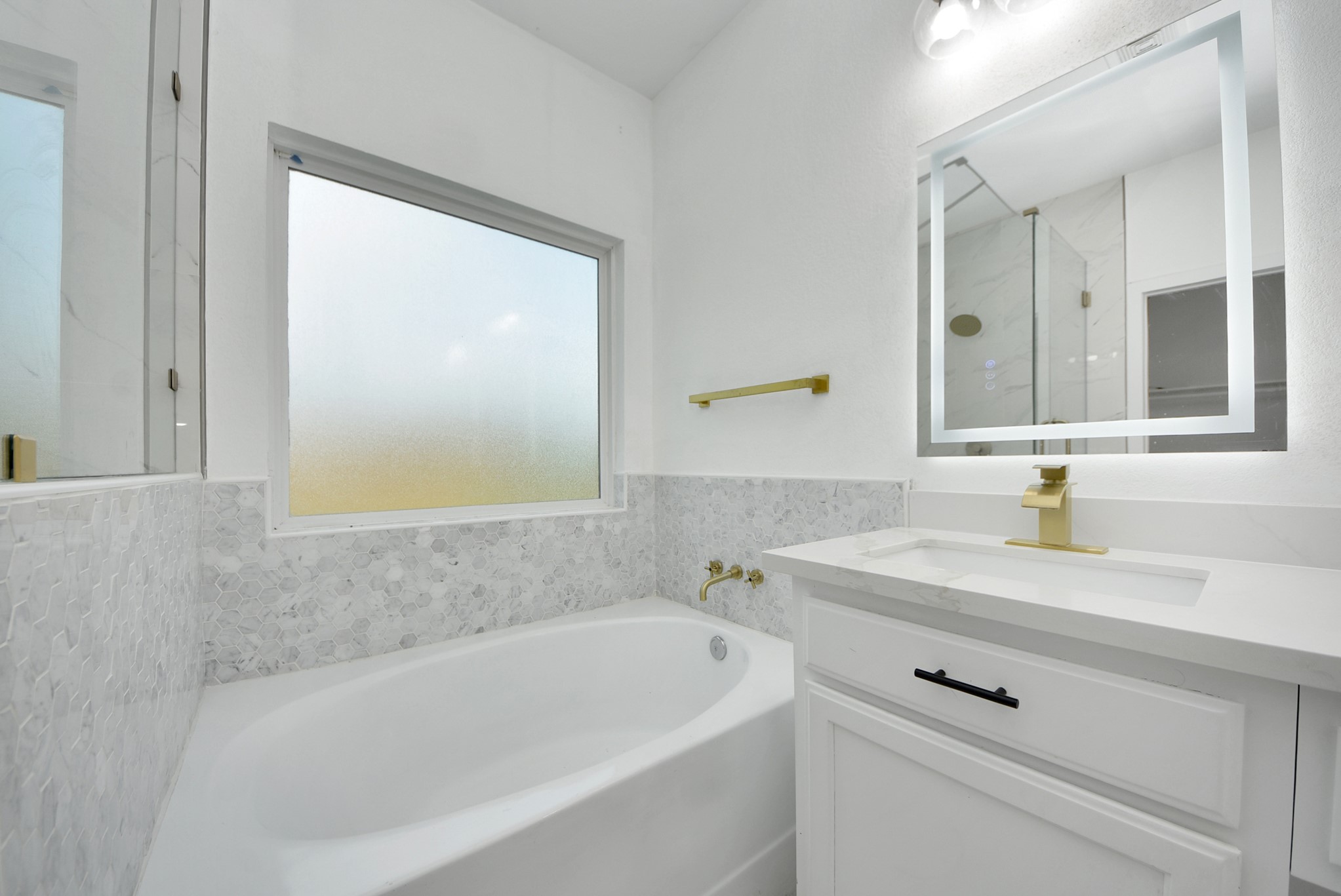 2311 Canfield Street Houston, TX 77004 - Photo 27 of 38 a bathroom with a bathtub and a sink