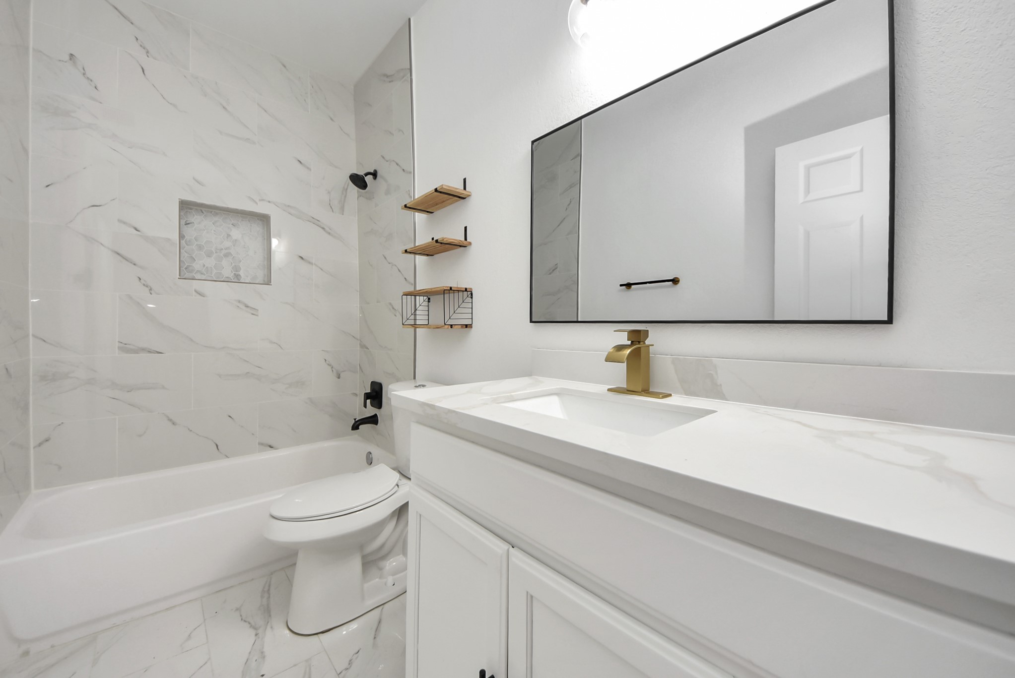 2311 Canfield Street Houston, TX 77004 - Photo 29 of 38 a bathroom with a sink a toilet and shower