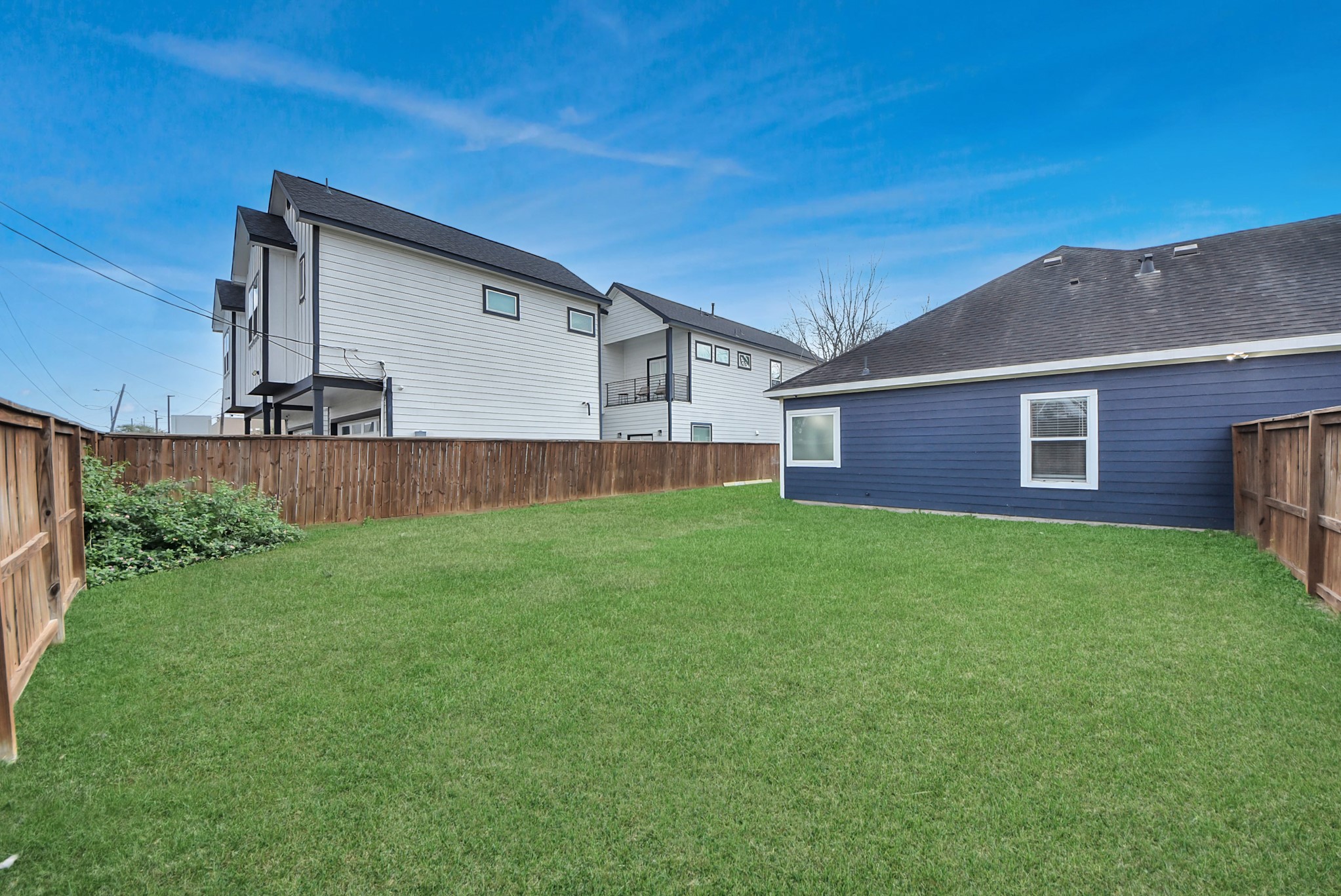 2311 Canfield Street Houston, TX 77004 - Photo 35 of 38 a backyard of a house with lots of green space