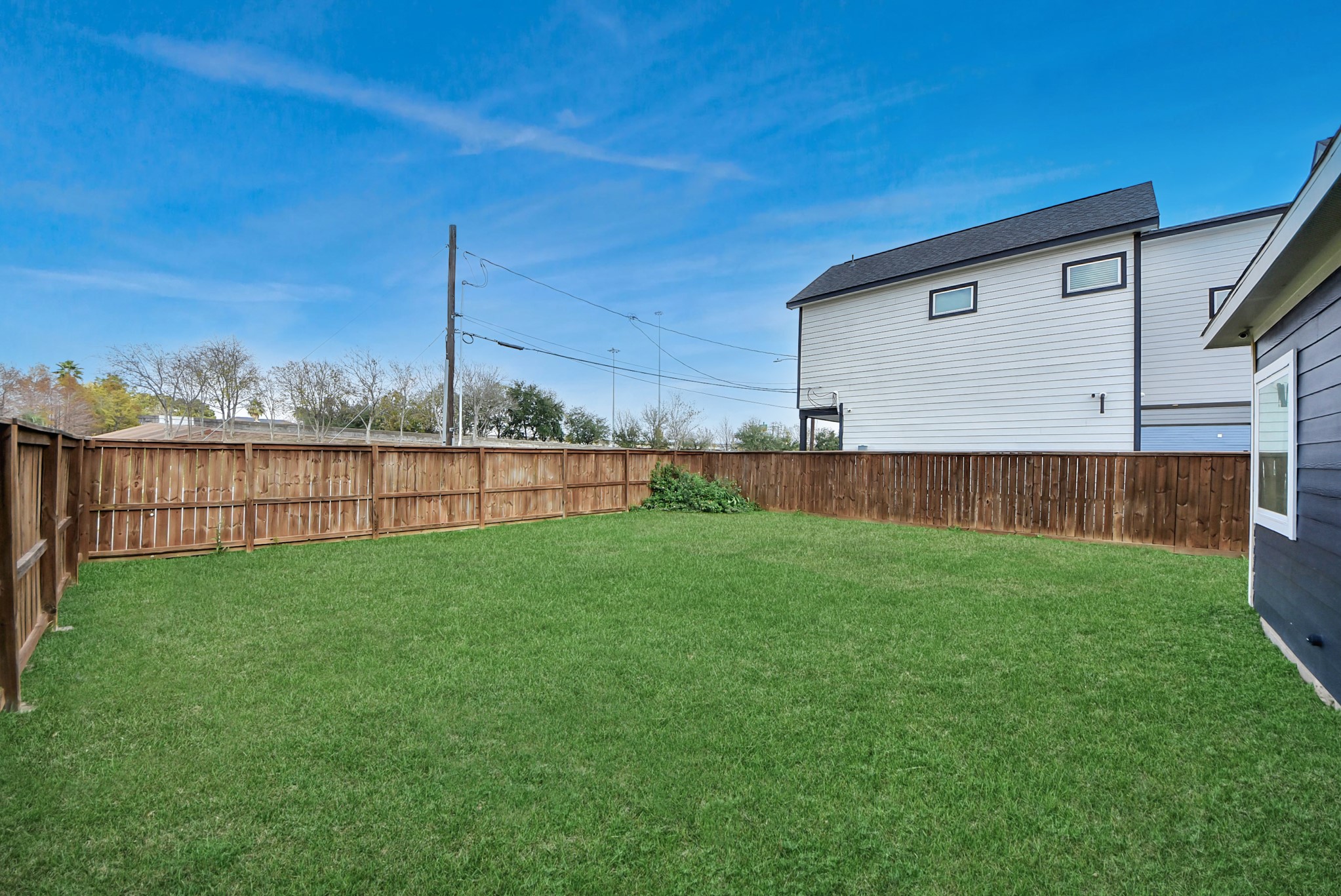 2311 Canfield Street Houston, TX 77004 - Photo 36 of 38 a view of a backyard with wooden fence