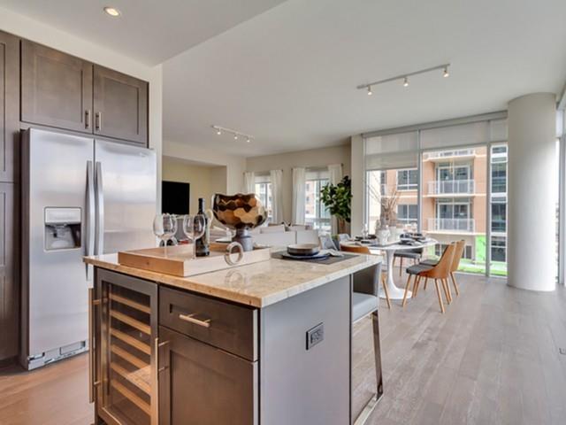 7775 Firefall Way, Unit 1512 Dallas, TX 75230 - Photo 15 of 23 a open kitchen with stainless steel appliances granite countertop a sink a stove and refrigerator