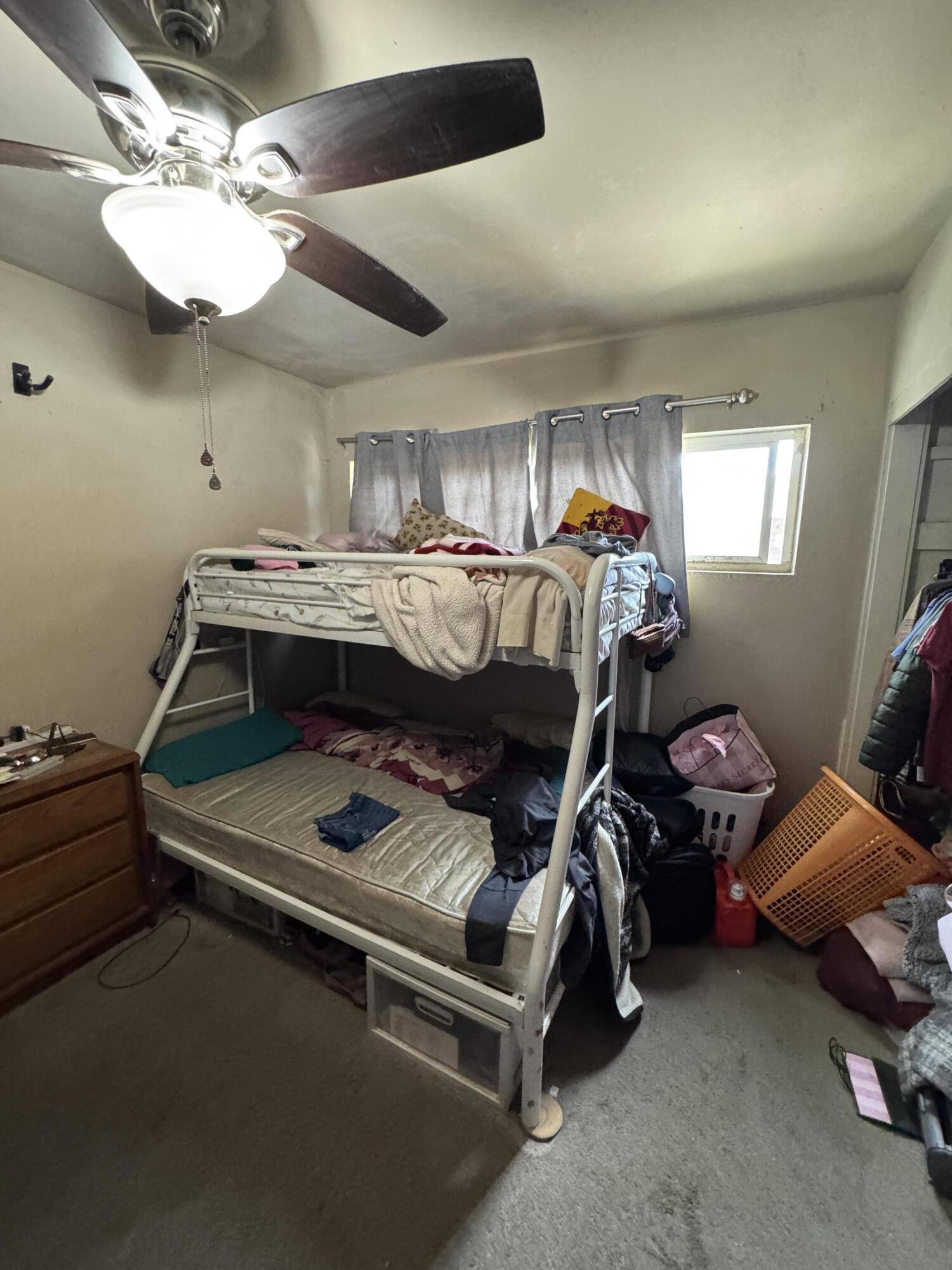 704 North Floral Street Visalia, CA 93291 - Photo 42 of 51 a bedroom with bed and window