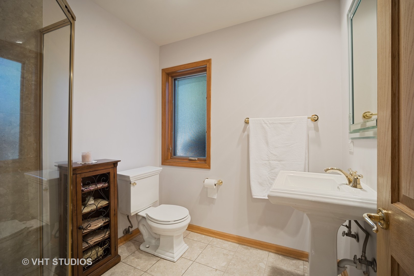 501 Warren Road Glenview, IL 60025 - Photo 14 of 29 a bathroom with a sink a toilet and shower