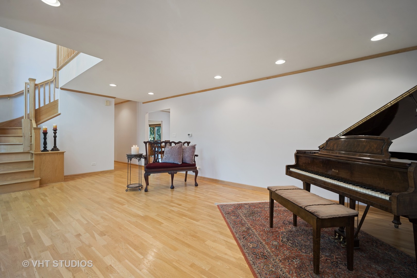 501 Warren Road Glenview, IL 60025 - Photo 3 of 29 a living room with furniture and a piano