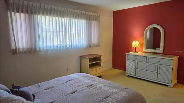 a front view of a house with a yard table and chairs