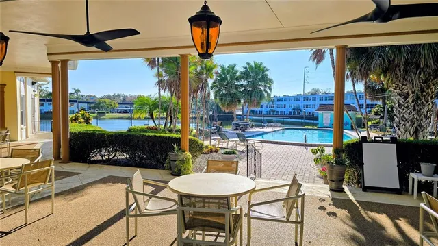 a backyard of a house with outdoor seating