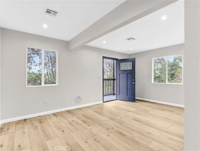 a view of an empty room with a window