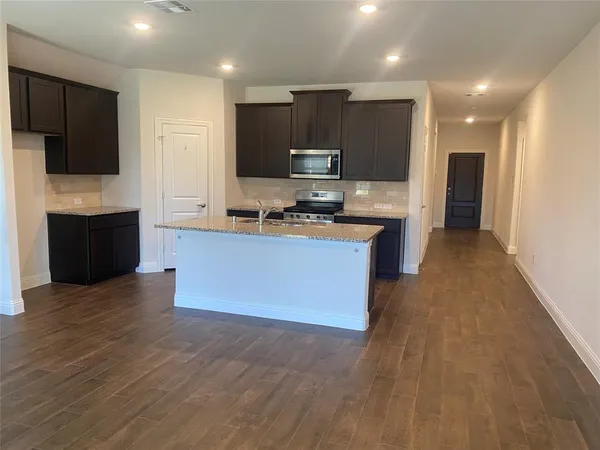 a large kitchen with cabinets
