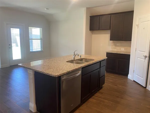 a kitchen with a sink and cabinets